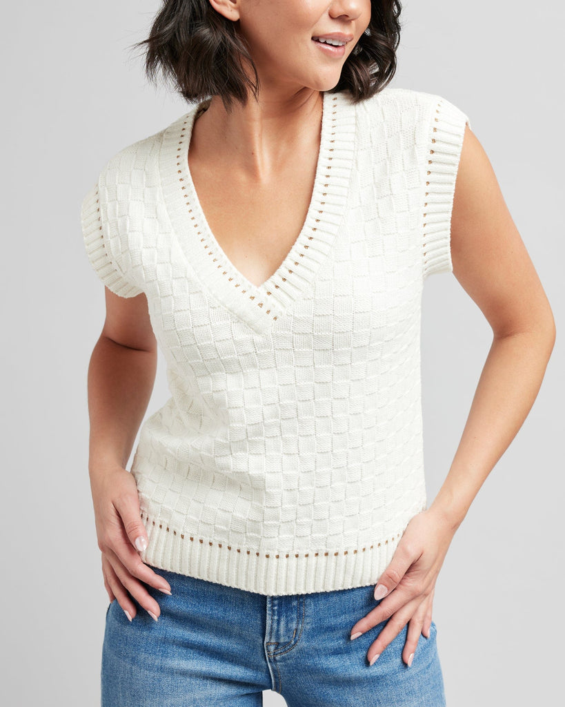 Woman in a textured knit pullover vest