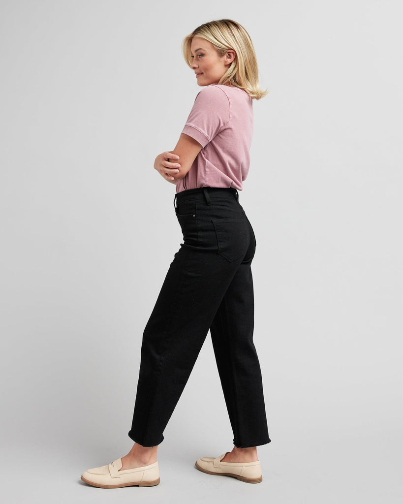 Woman in black wide-leg crop jeans