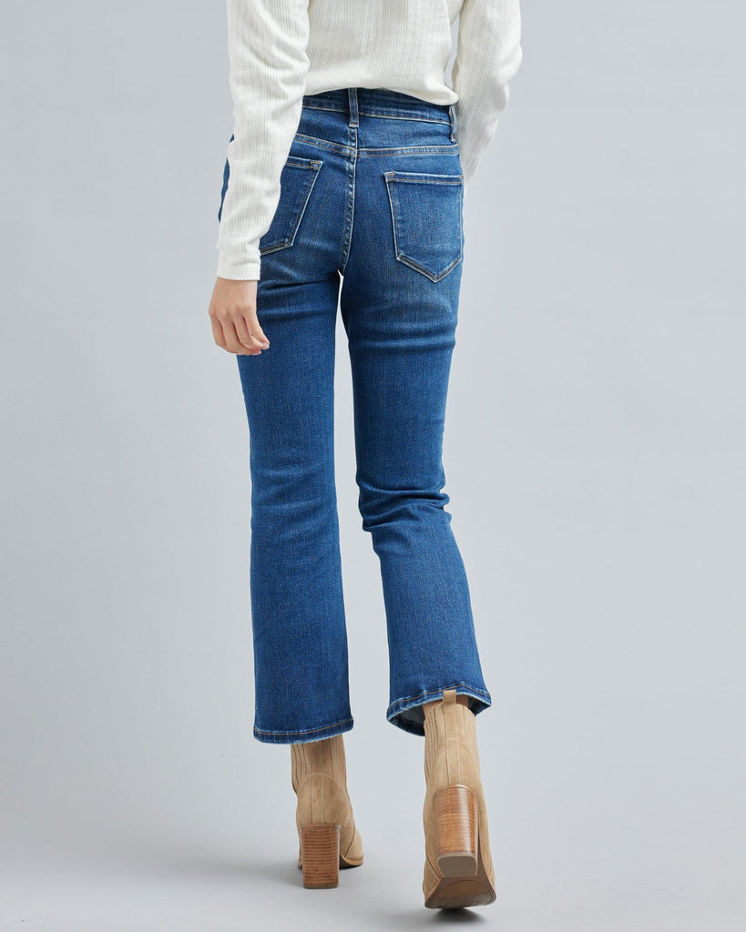 Woman in blue jean, ankle length denim pants.