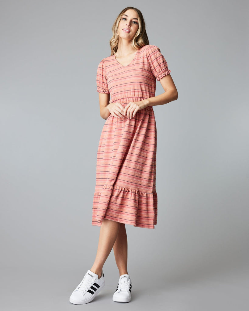 Woman in a short sleeve, striped, pink, midi-length dress