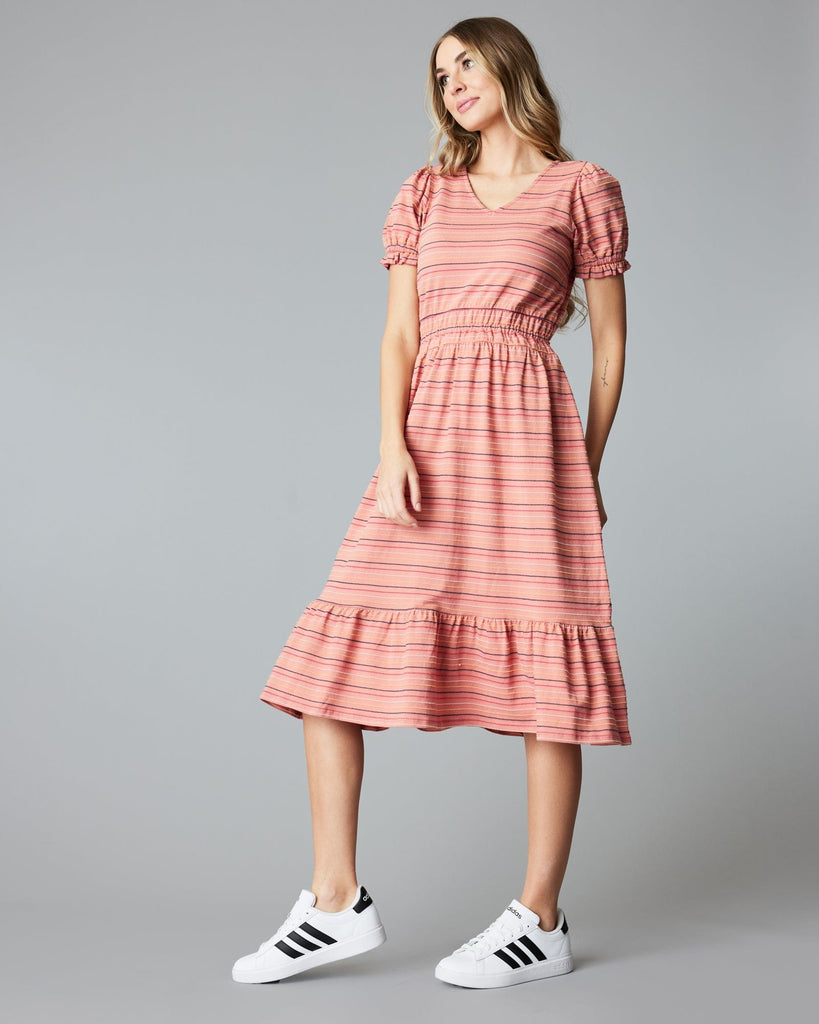 Woman in a short sleeve, striped, pink, midi-length dress