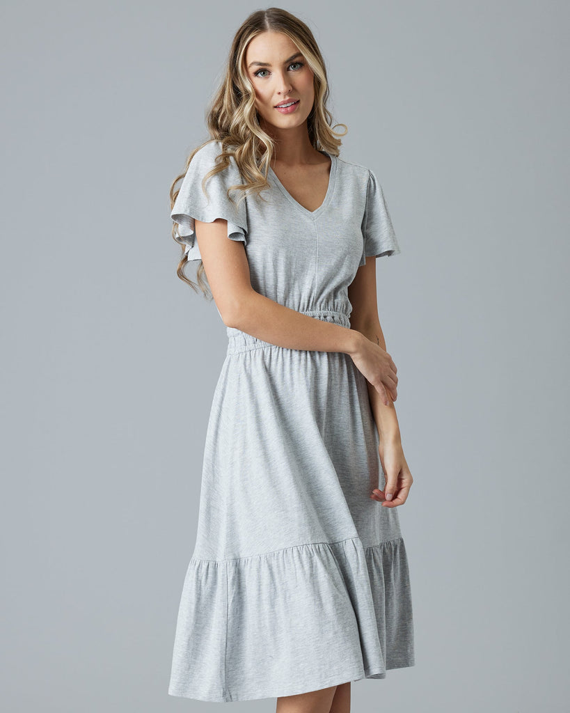 Woman in a grey short sleeve midi dress