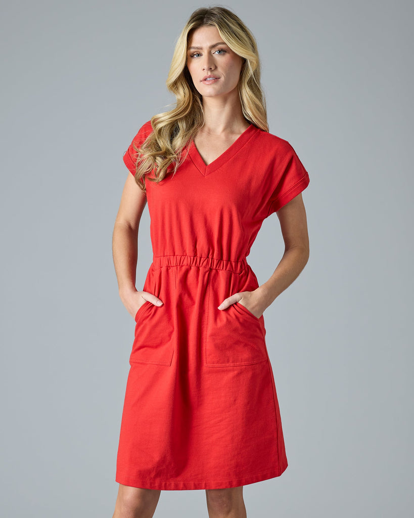 Woman in red short sleeve, knee-length dress with pockets