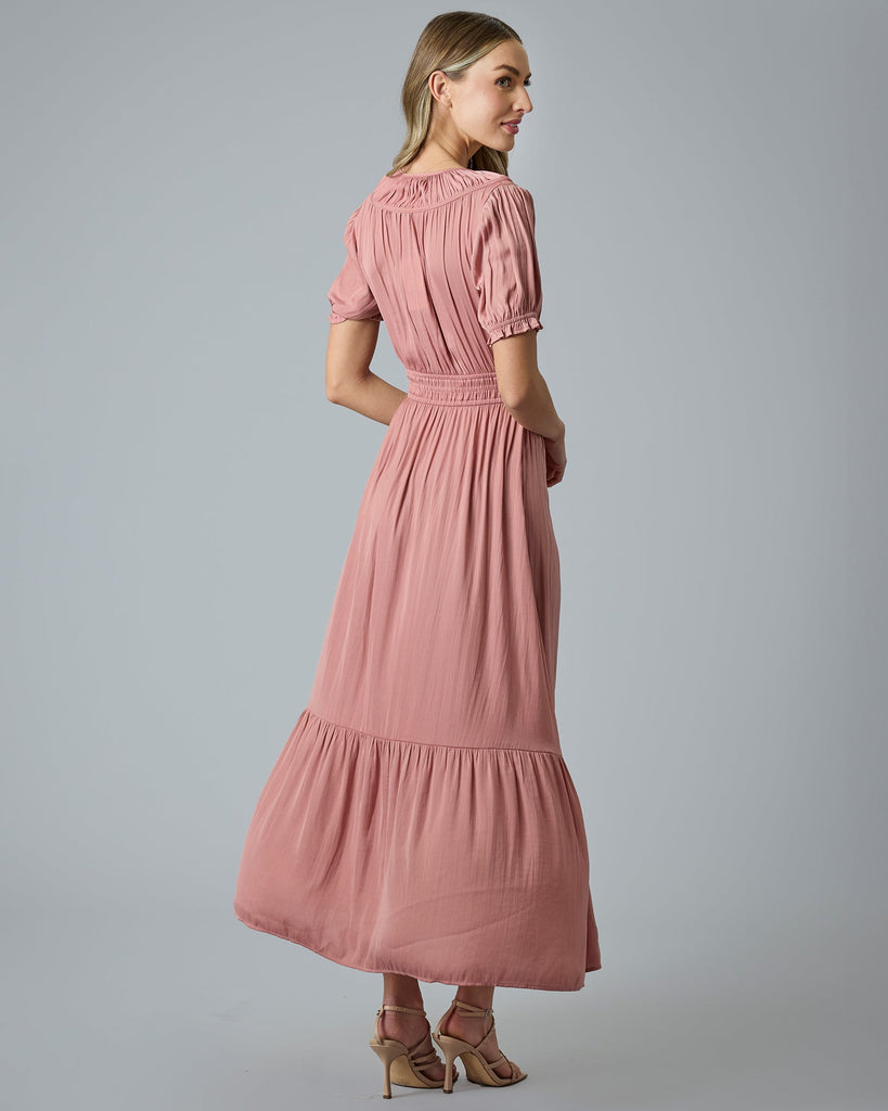 Woman in a pink short sleeve maxi dress