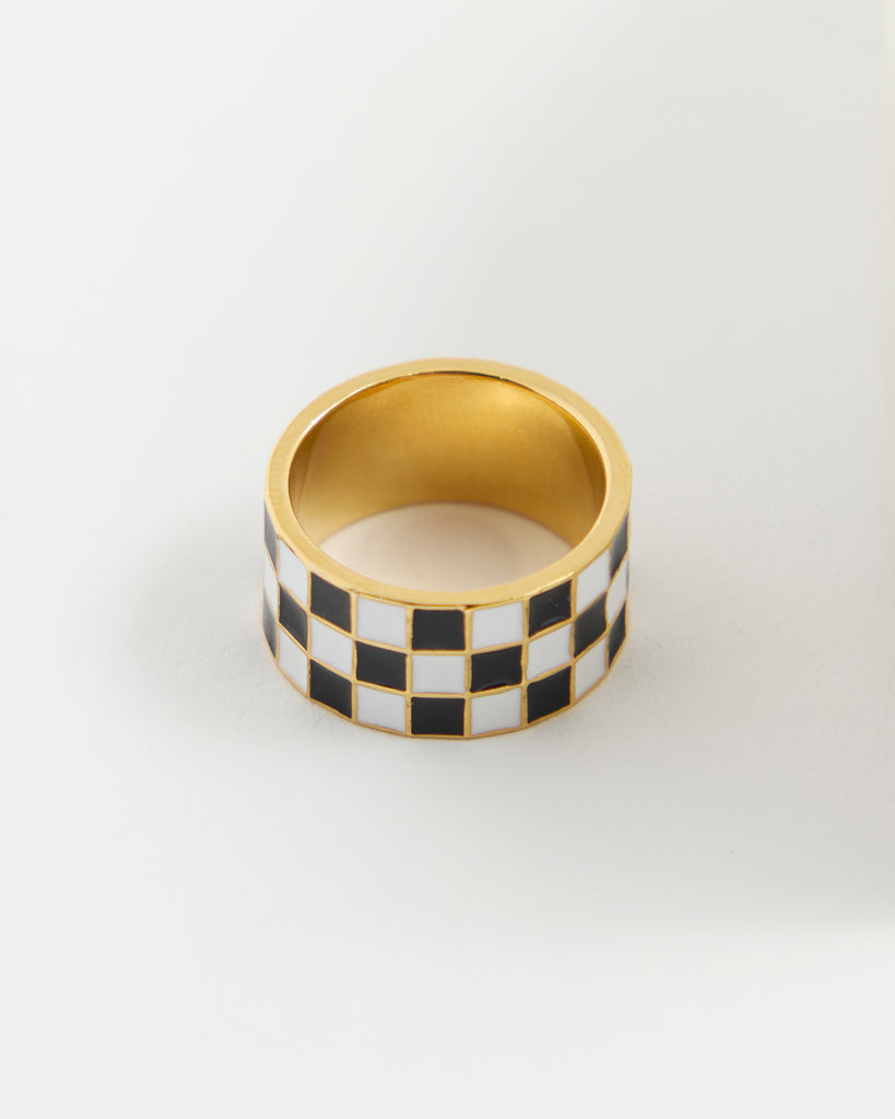 Black and white checkered gold ring