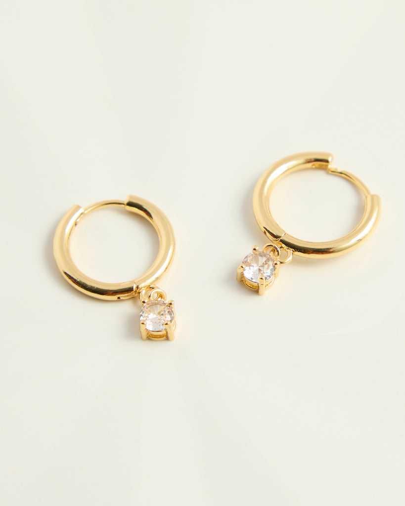 Gold hoop earrings with cubic zirconia gem