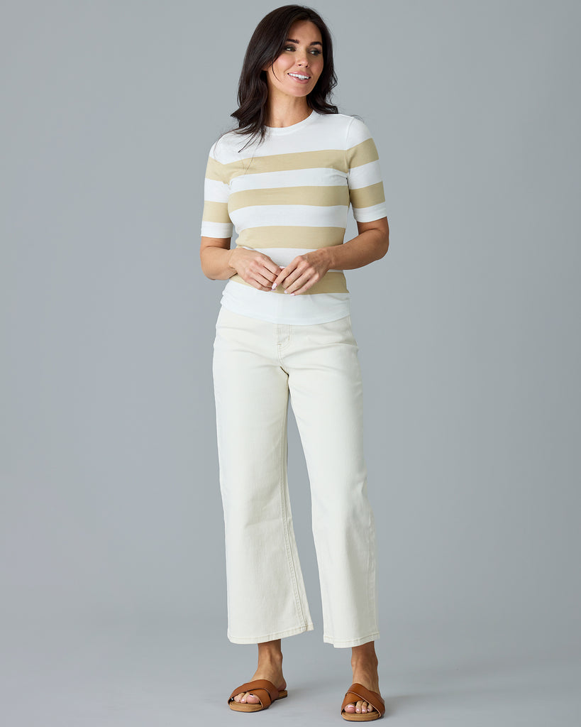 Woman in a khaki and white striped, short sleeve t-shirt