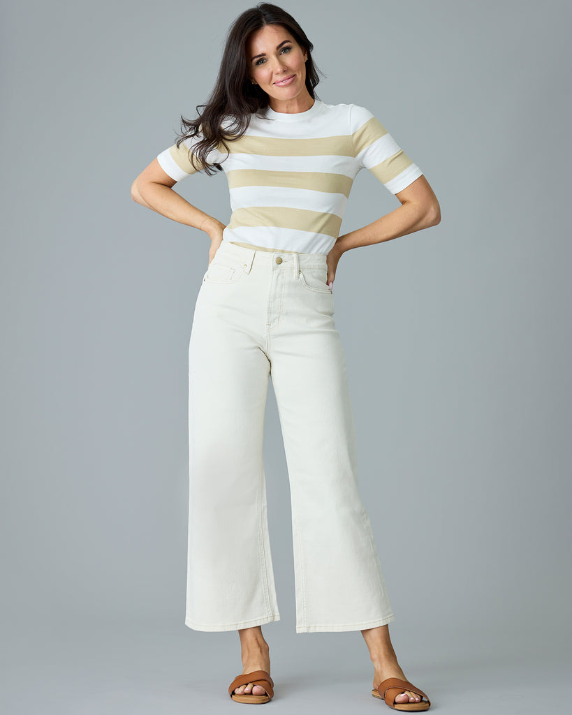 Woman in a khaki and white striped, short sleeve t-shirt