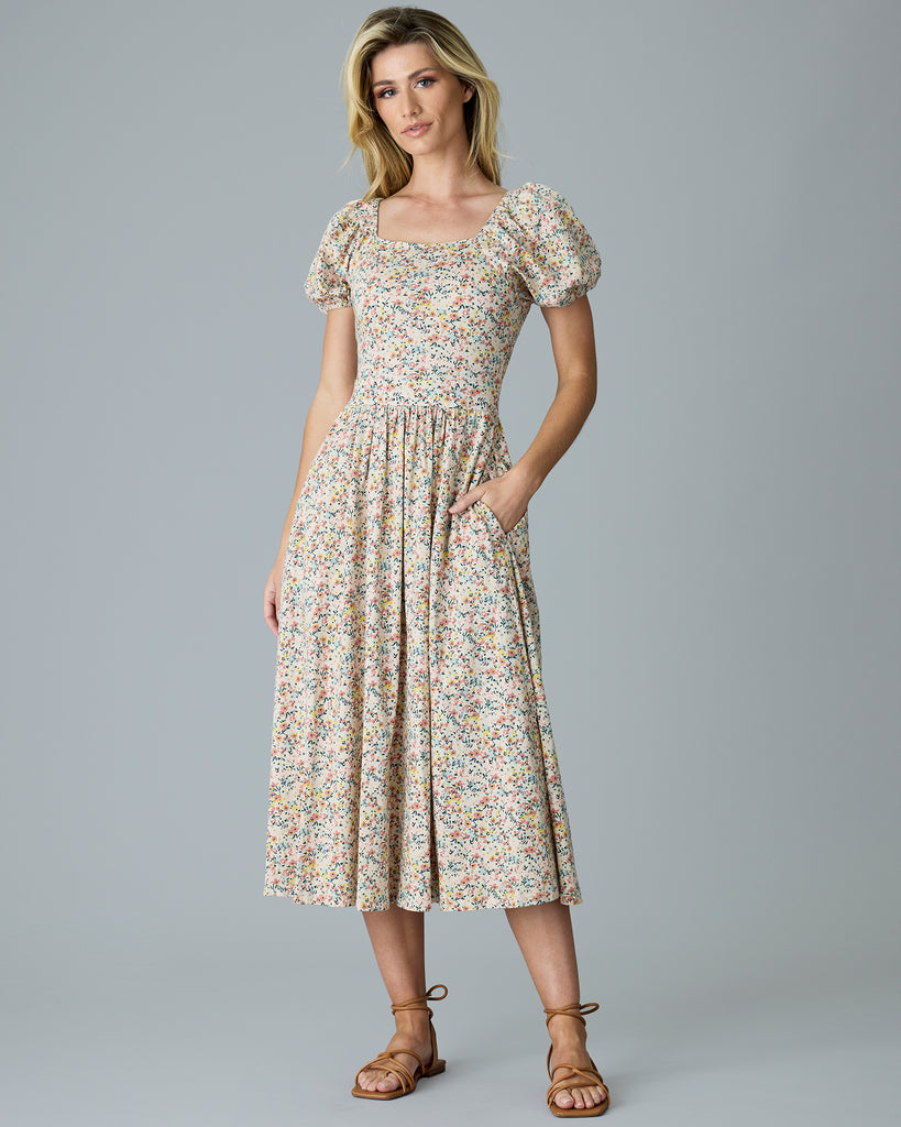 Woman in a floral print, short sleeve dress