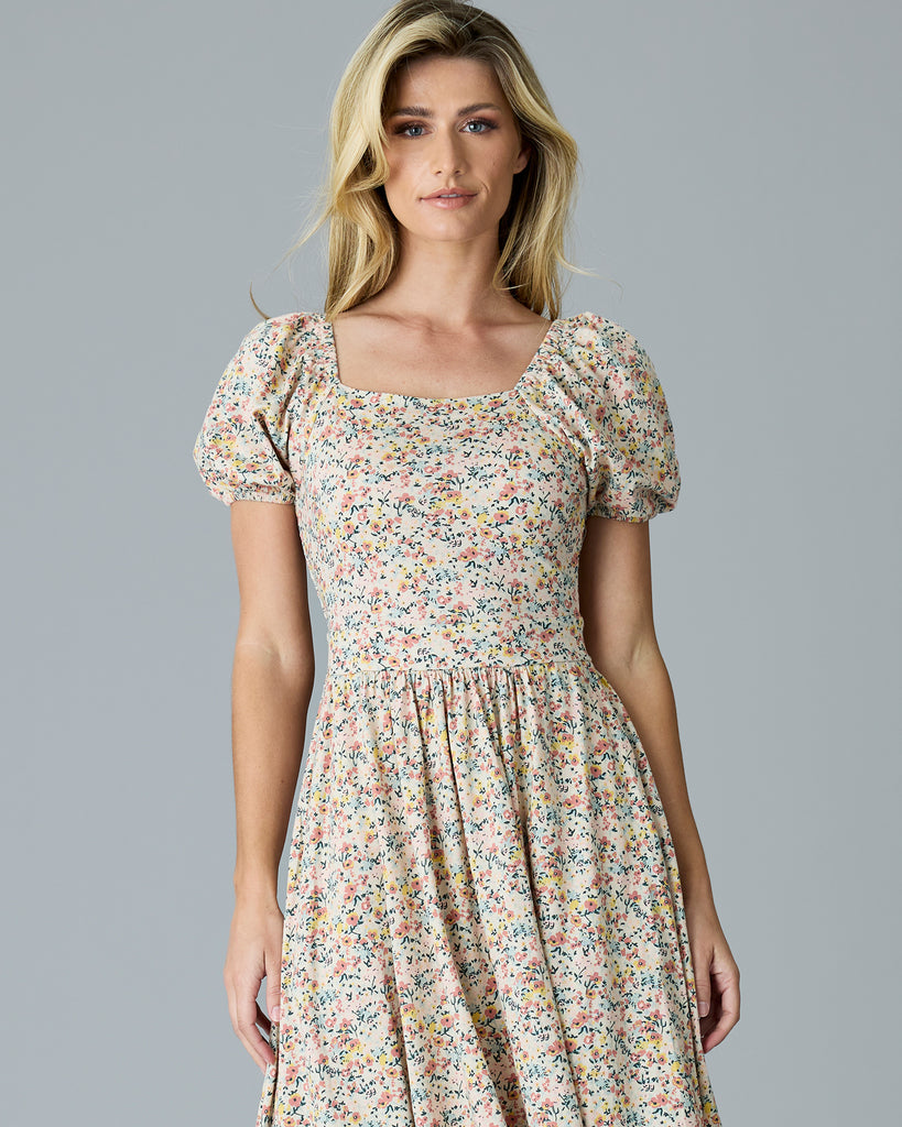 Woman in a floral print, short sleeve dress