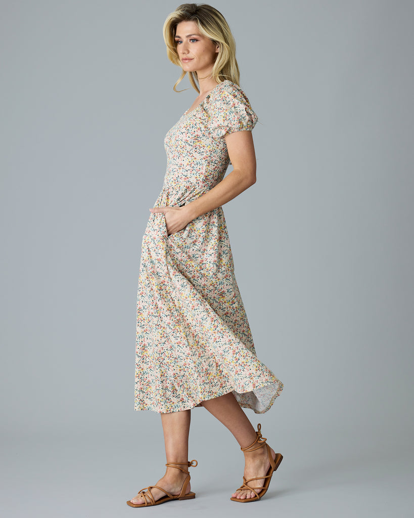 Woman in a floral print, short sleeve dress