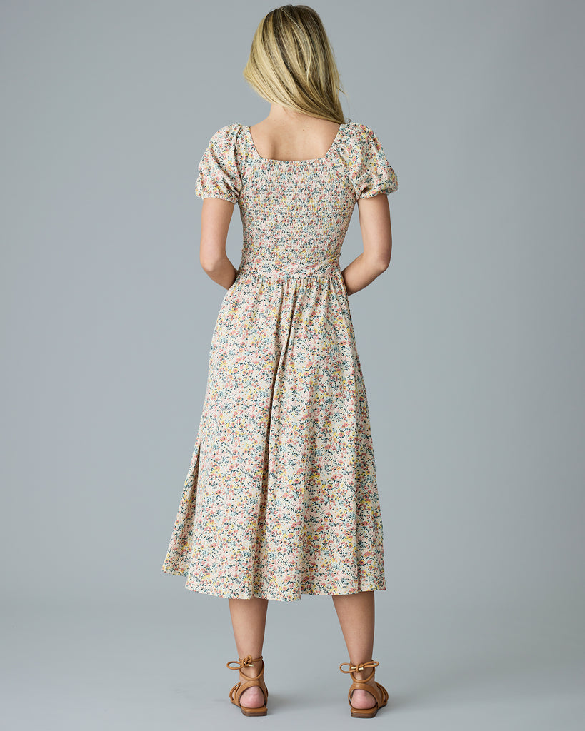 Woman in a floral print, short sleeve dress