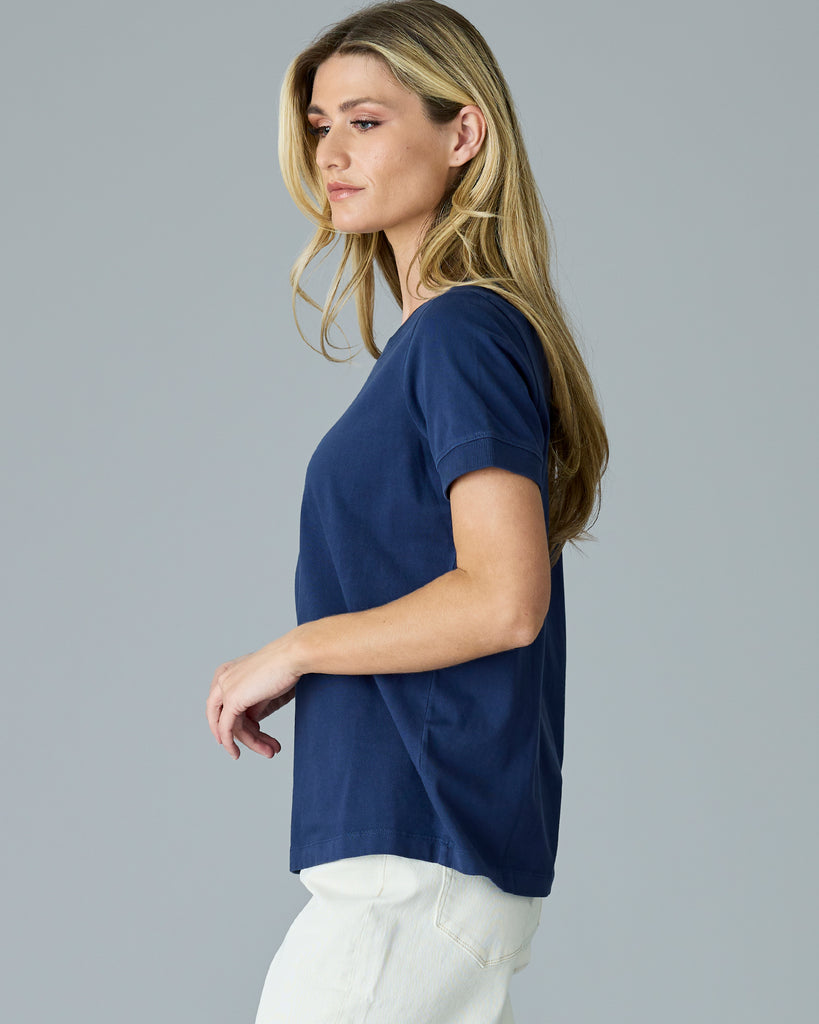 Woman in a navy basic t-shirt