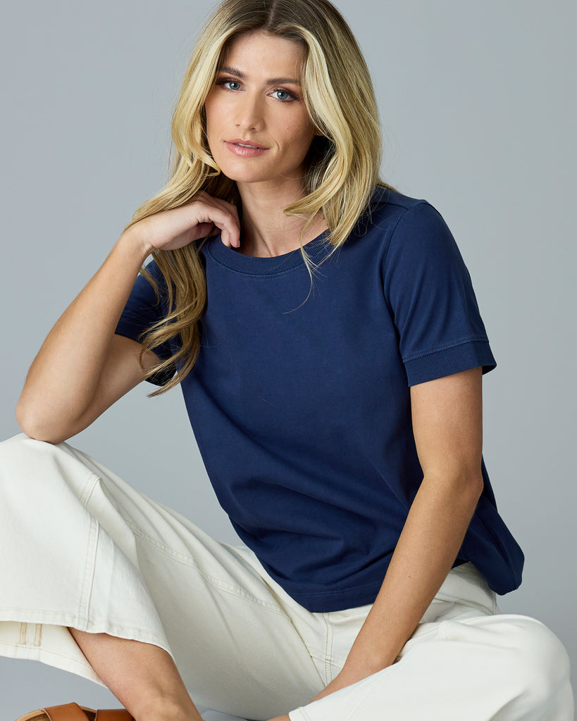 Woman in a navy basic t-shirt