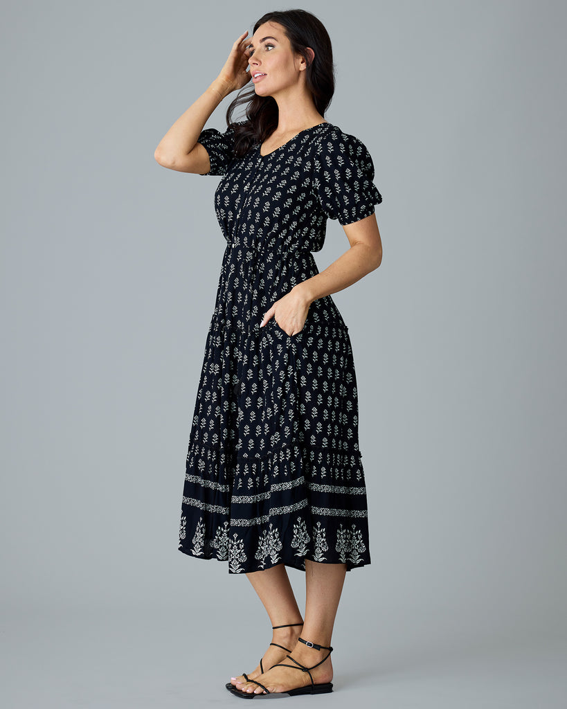 Woman in a black and white short sleeve dress