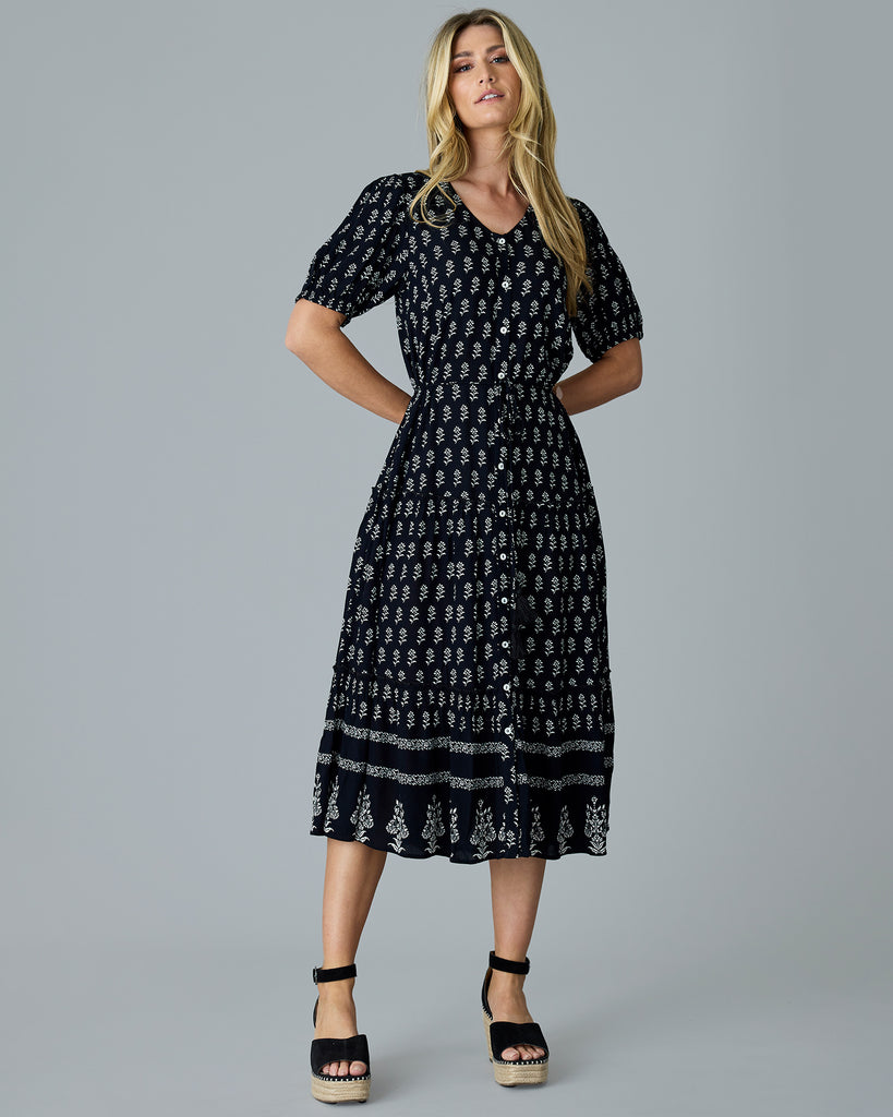 Woman in a black and white short sleeve dress