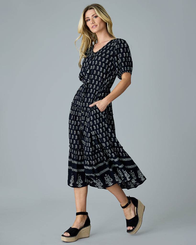 Woman in a black and white short sleeve dress