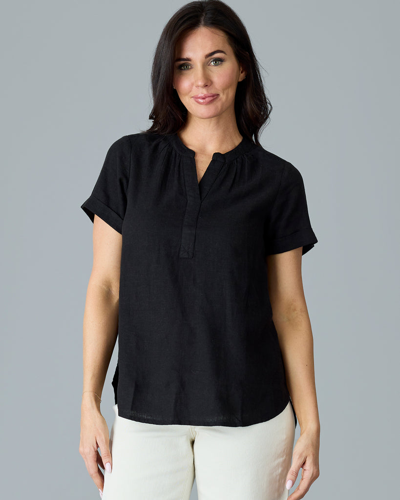 Woman in a black short sleeve blouse