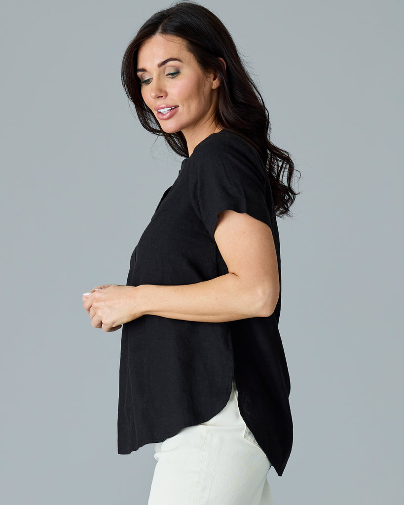 Woman in a black short sleeve blouse