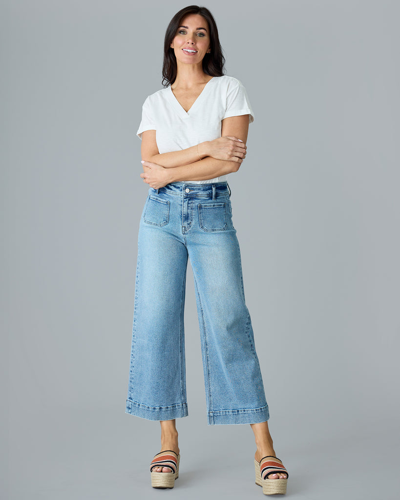 Woman in light blue cropped denim pants