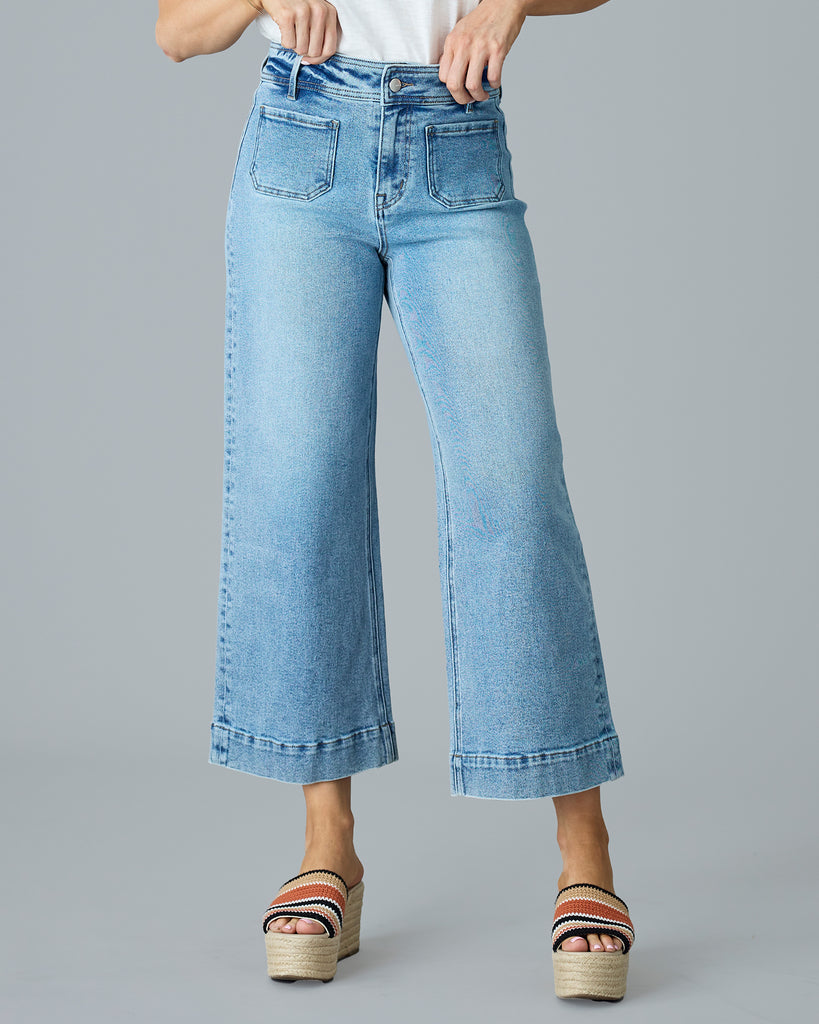 Woman in light blue cropped denim pants