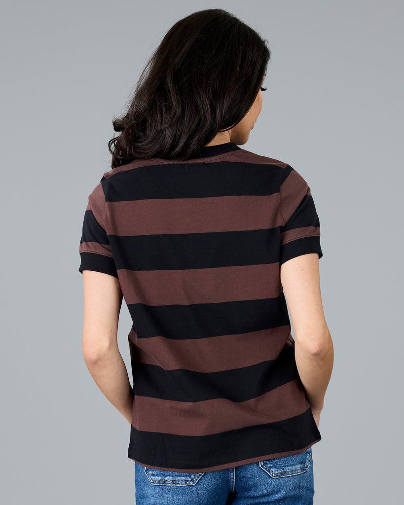 Woman in a short sleeve brown and black striped t-shirt