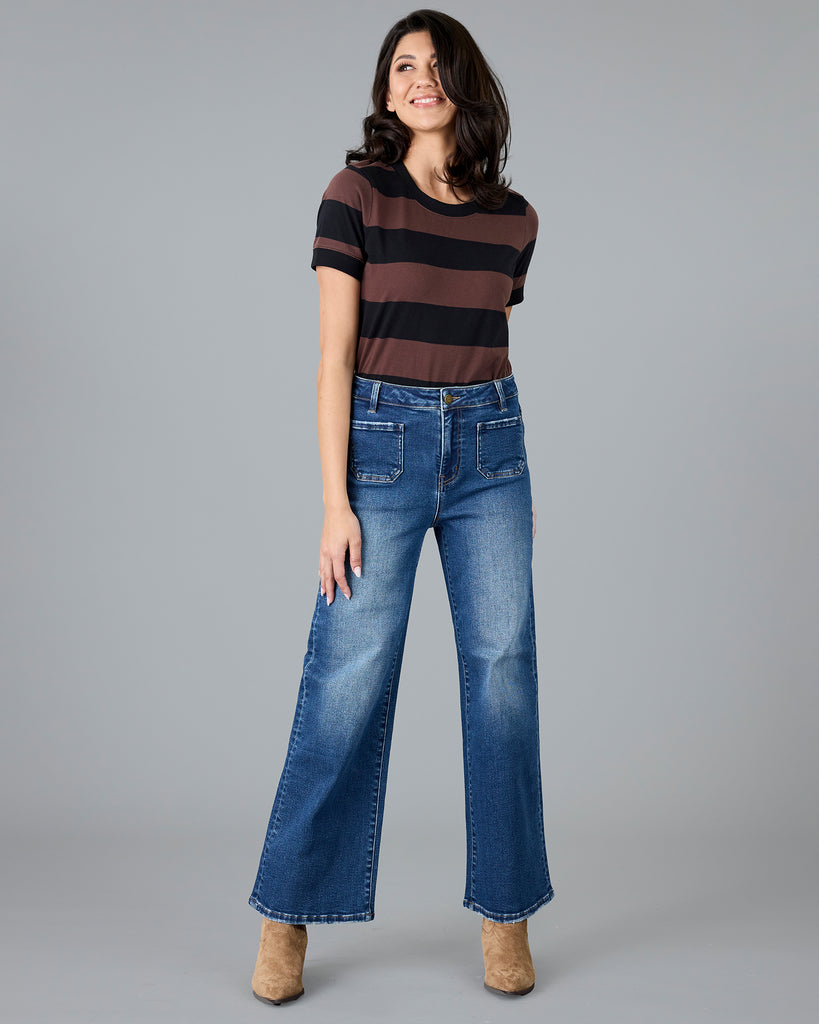 Woman in a short sleeve brown and black striped t-shirt