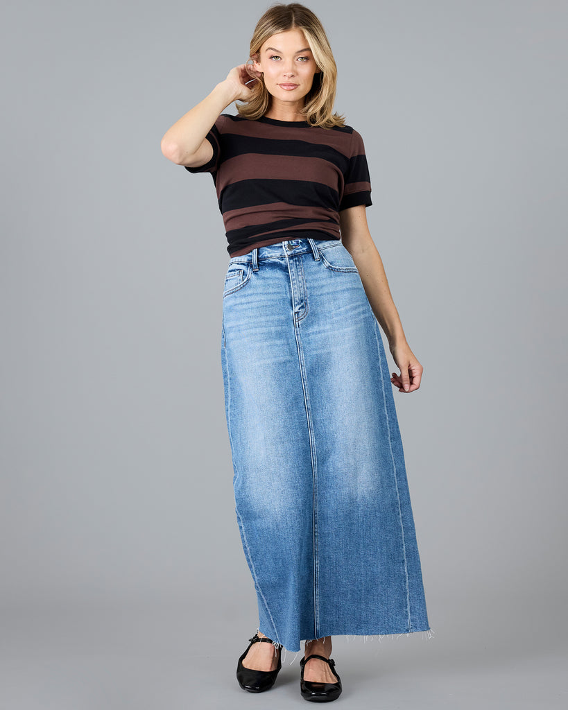 Woman in a short sleeve brown and black striped t-shirt