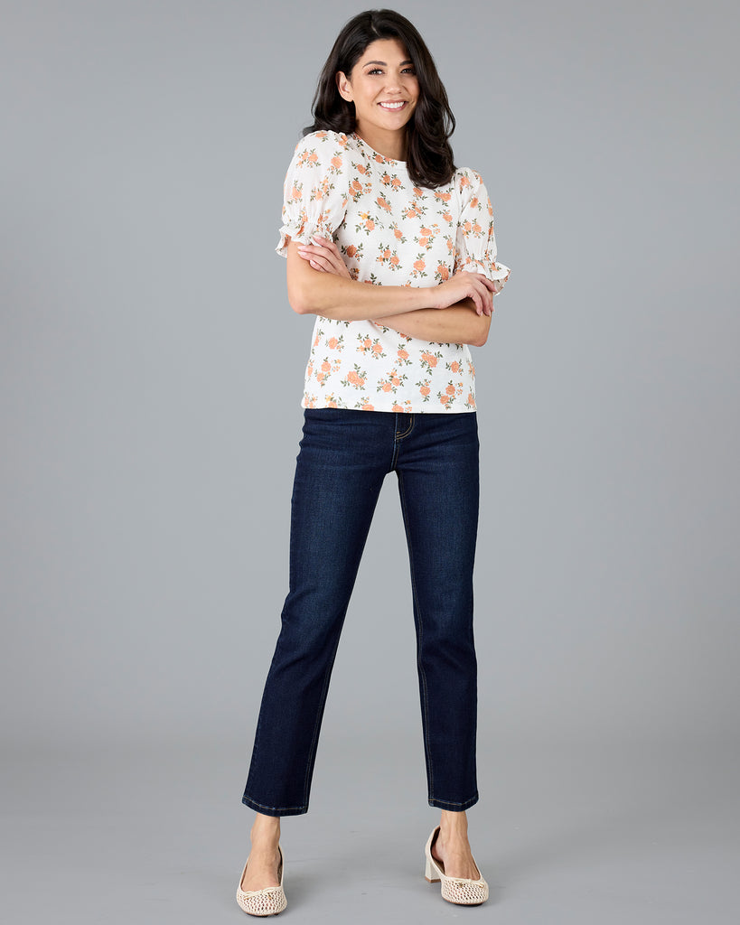 Woman in a short sleeve floral print top