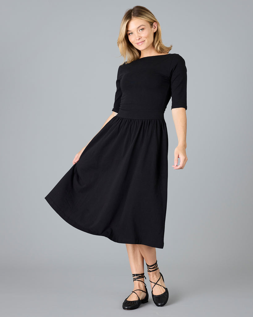 Woman in a black half sleeved a-line dress