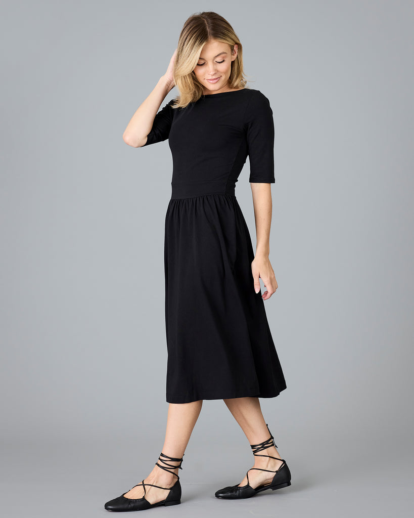 Woman in a black half sleeved a-line dress