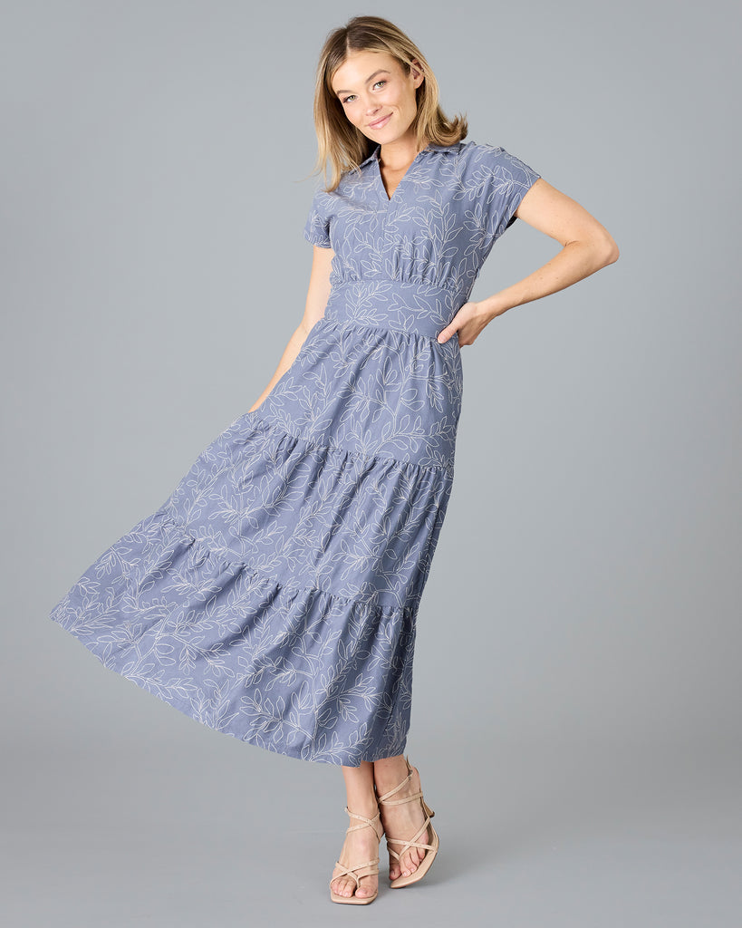 Woman in a blue short sleeve dress