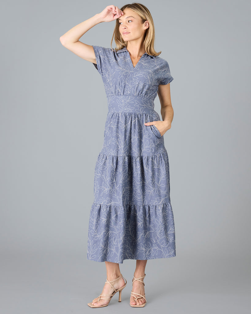 Woman in a blue short sleeve dress