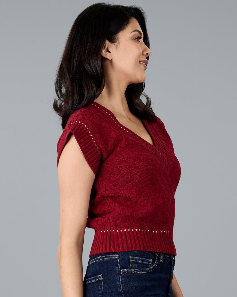 Woman in a red knit vest