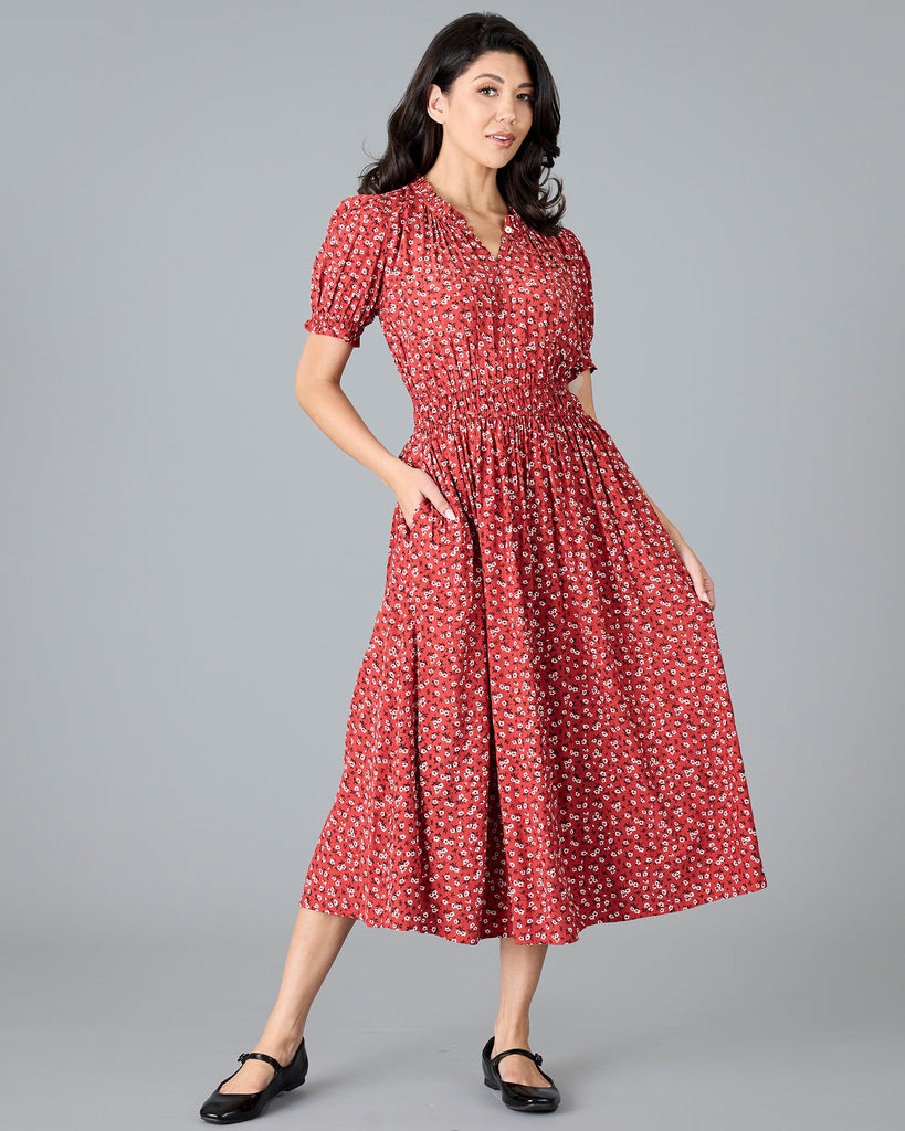 Woman in a red floral print short sleeve midi dress