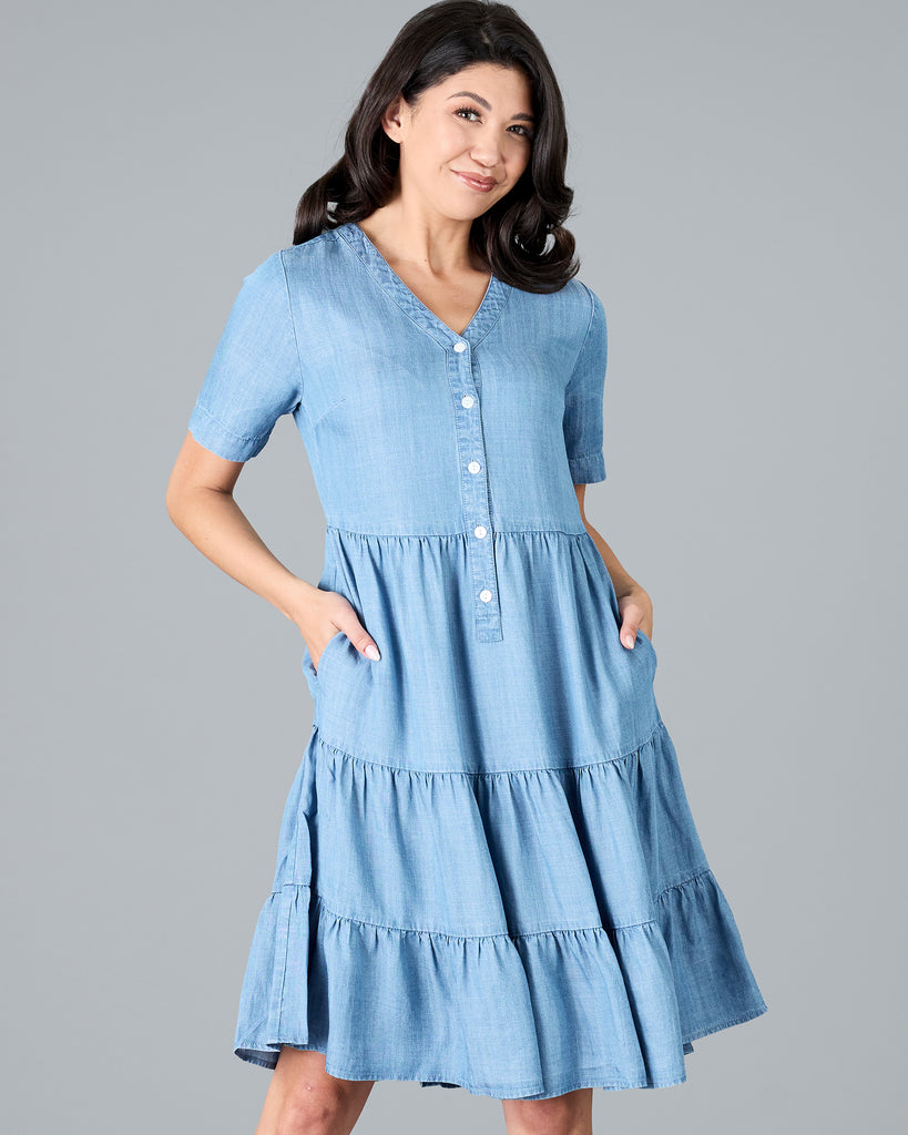 Woman in a short sleeve, knee-length chambray dress