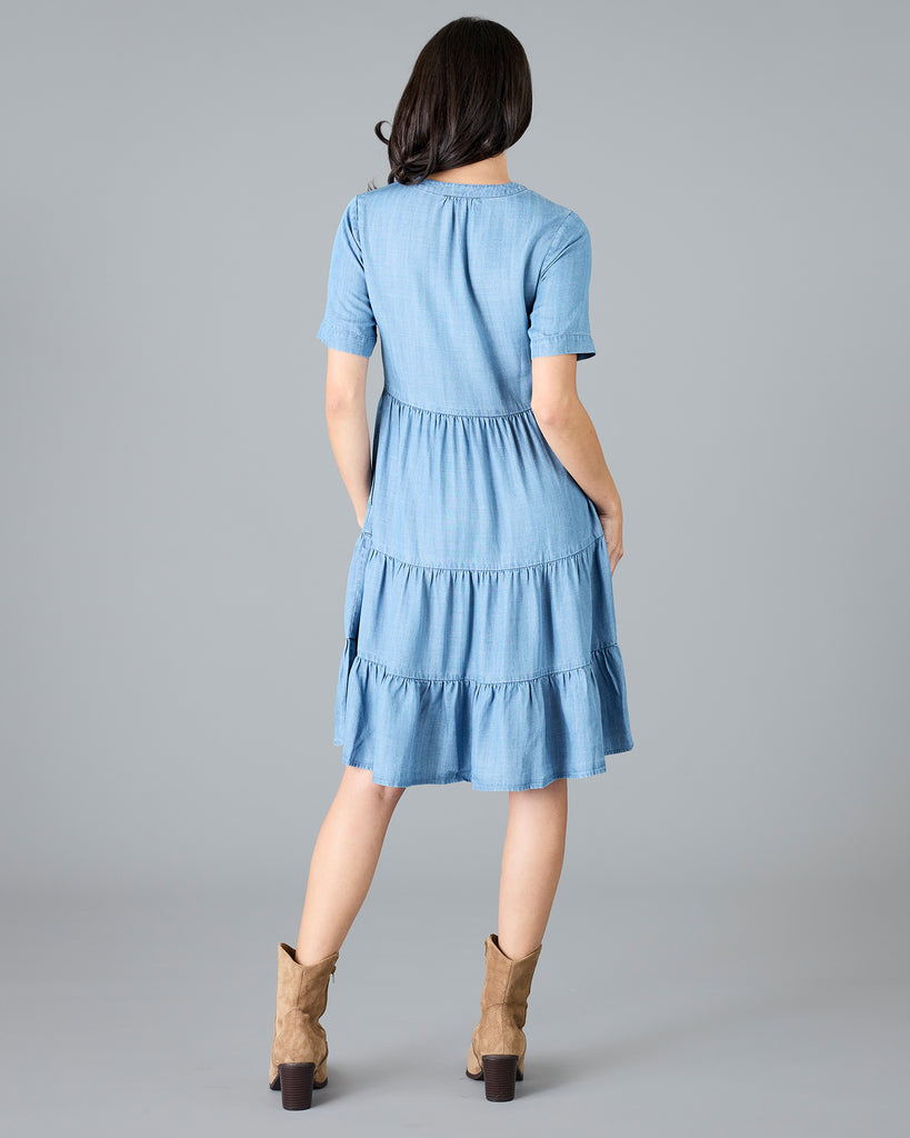 Woman in a short sleeve, knee-length chambray dress