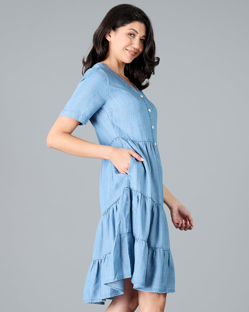 Woman in a short sleeve, knee-length chambray dress