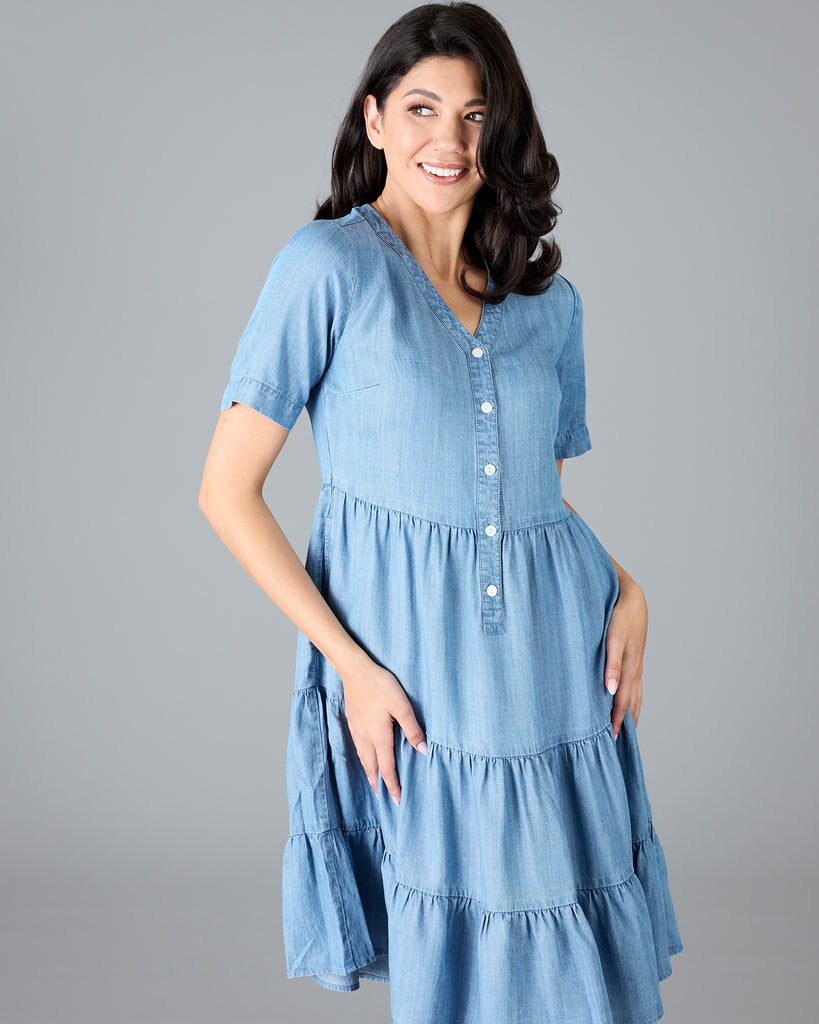 Woman in a short sleeve, knee-length chambray dress