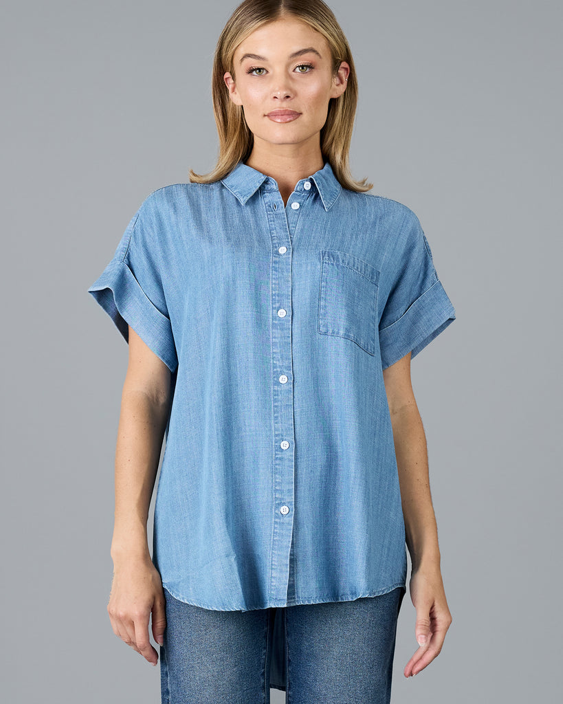 Woman in a short sleeve buttondown chambray top