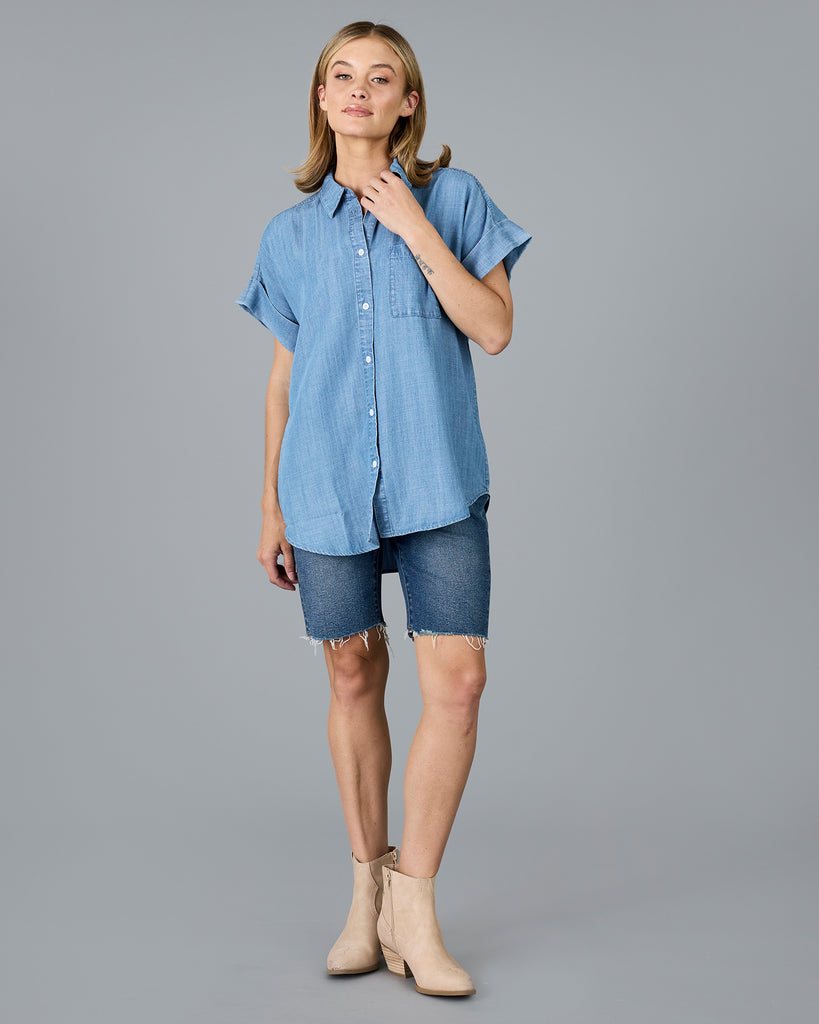 Woman in a short sleeve buttondown chambray top