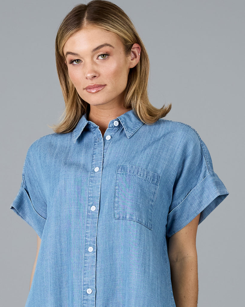 Woman in a short sleeve buttondown chambray top