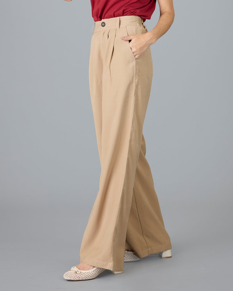 Woman in beige trousers