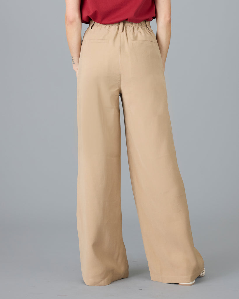 Woman in beige trousers