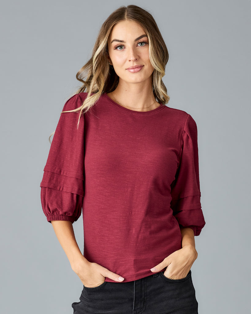 Woman in a red half sleeved tshirt