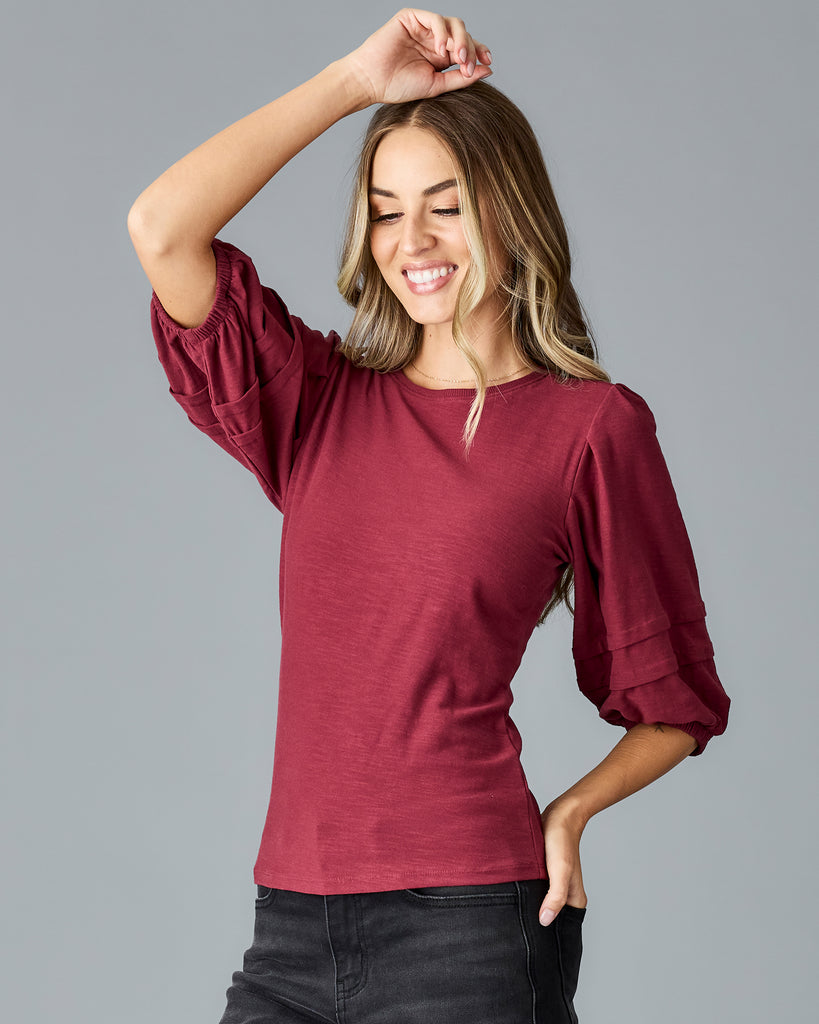 Woman in a red half sleeved tshirt