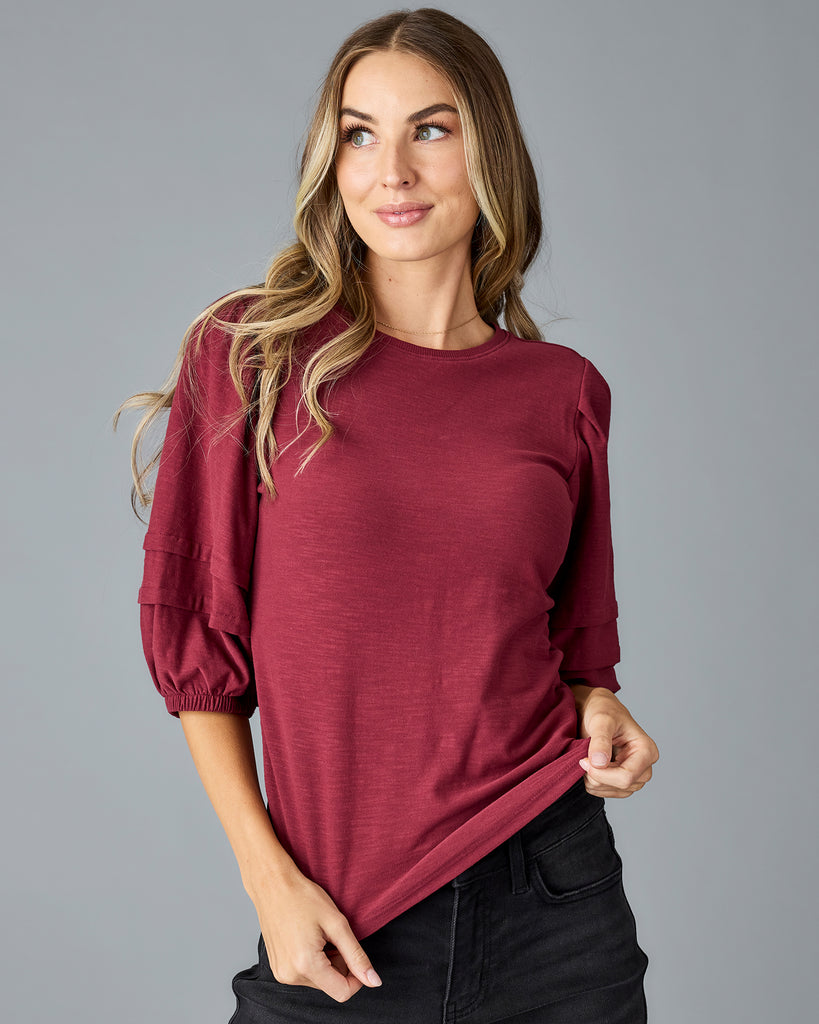 Woman in a red half sleeved tshirt