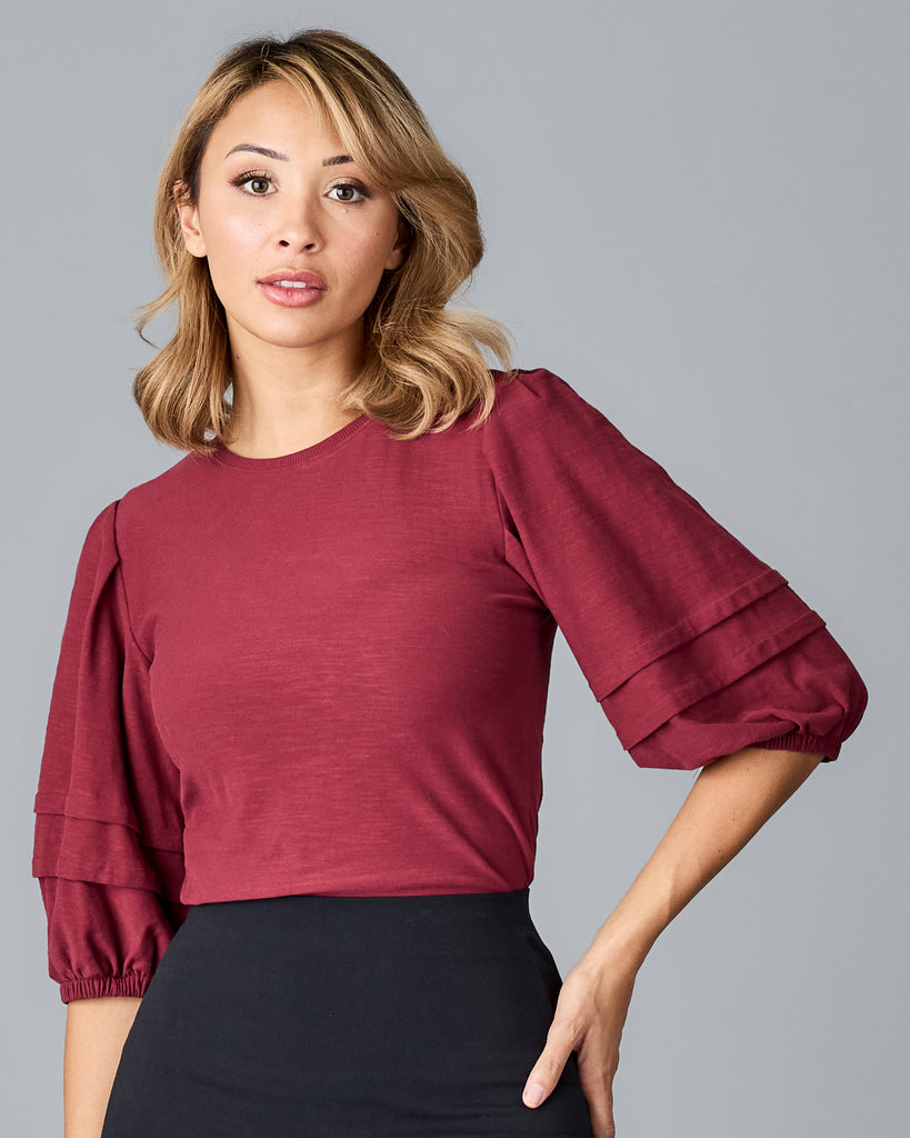 Woman in a red half sleeved tshirt