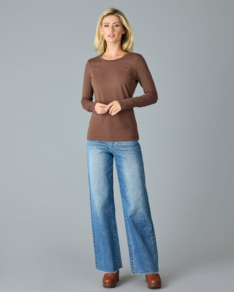 Woman in a brown, long sleeve basic t-shirt