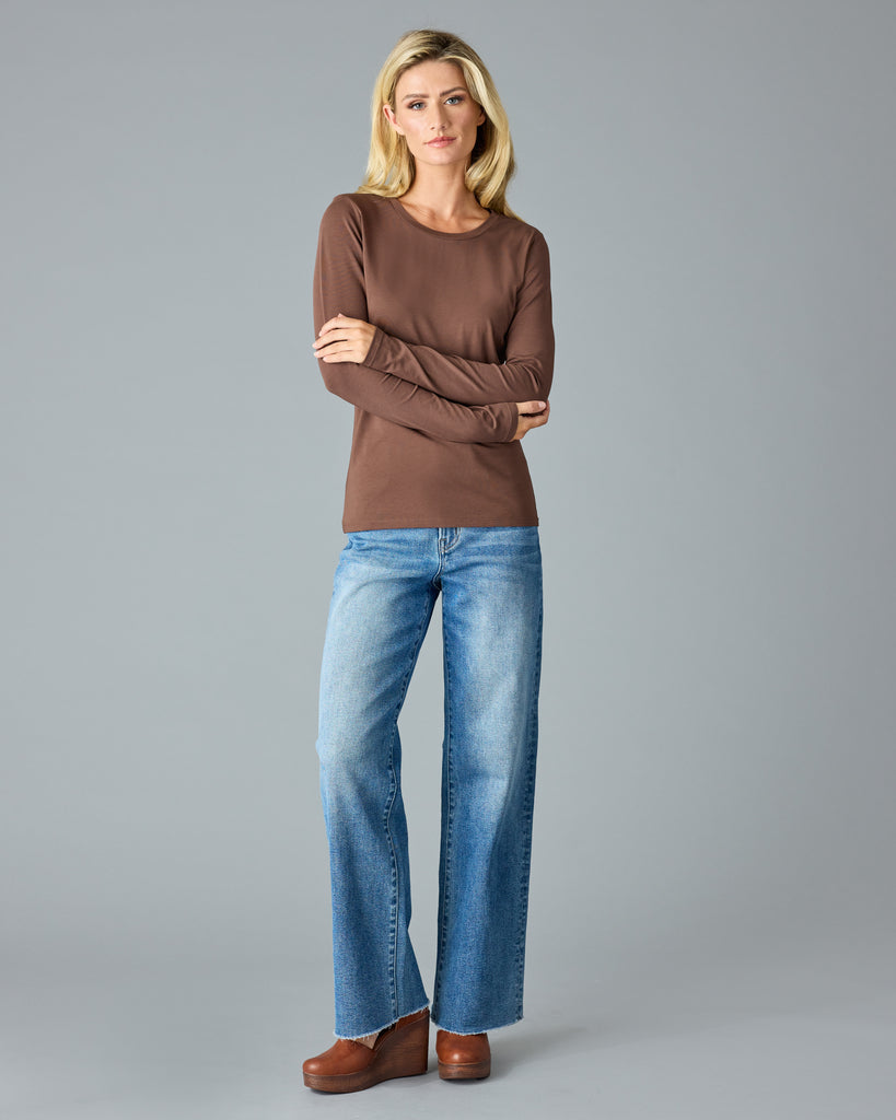 Woman in a brown, long sleeve basic t-shirt